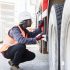 worker-inspecting-a-large-vehicle-s-tire-with-focu-2026-01-09-10-29-32-utc
